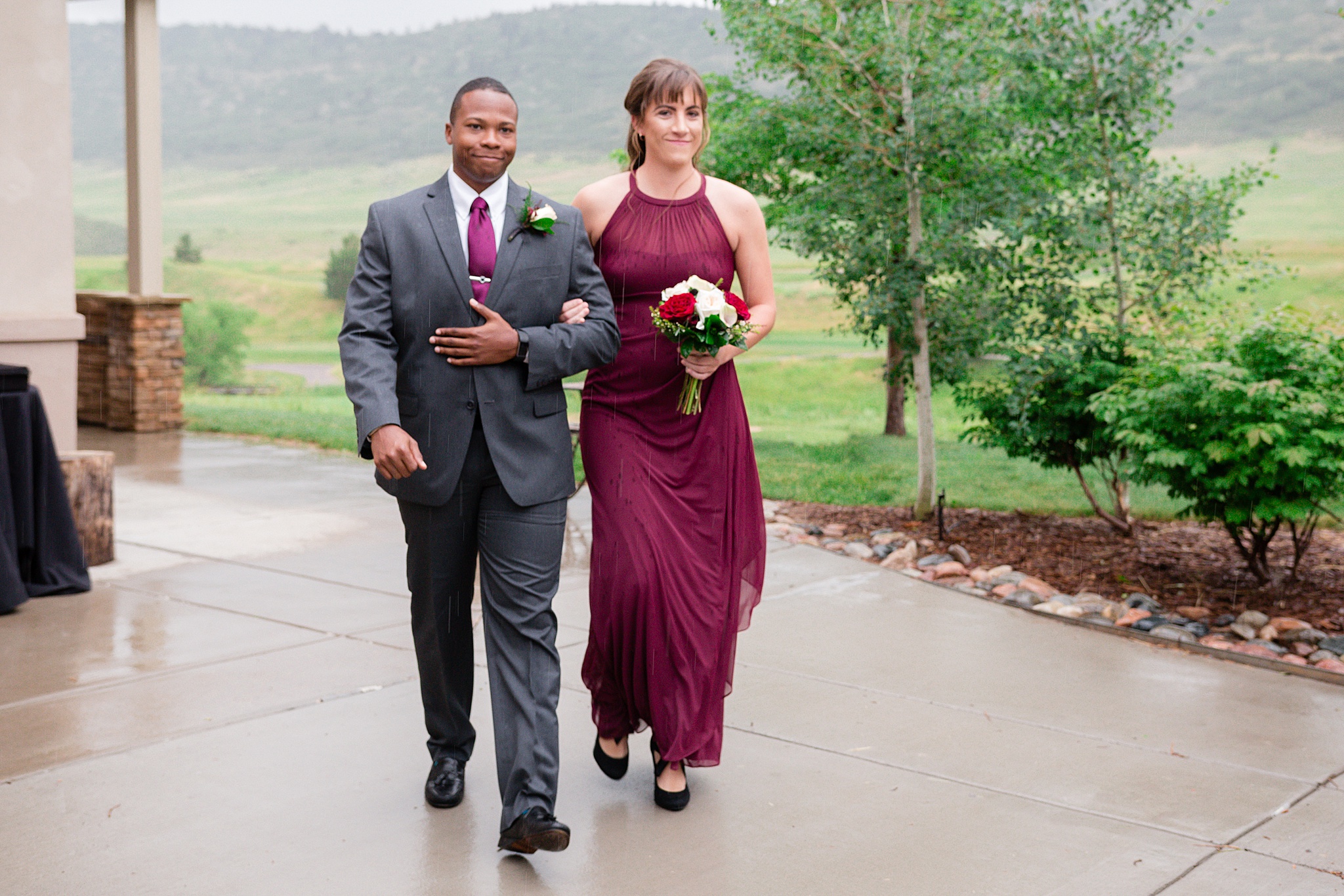 Bridal party walking down the aisle at a rainy summer wedding. Tania & Chris' Denver Wedding at the Wedgewood Ken Caryl by Colorado Wedding Photography, Jennifer Garza. Colorado Wedding Photographer, Colorado Wedding Photography, Denver Wedding Photographer, Denver Wedding Photography, US Marine Corp Wedding, US Marine Corp, Military Wedding, US Marines, Wedgewood Weddings, Wedgewood Weddings Ken Caryl, Colorado Wedding, Denver Wedding, Wedding Photographer, Colorado Bride, Brides of Colorado