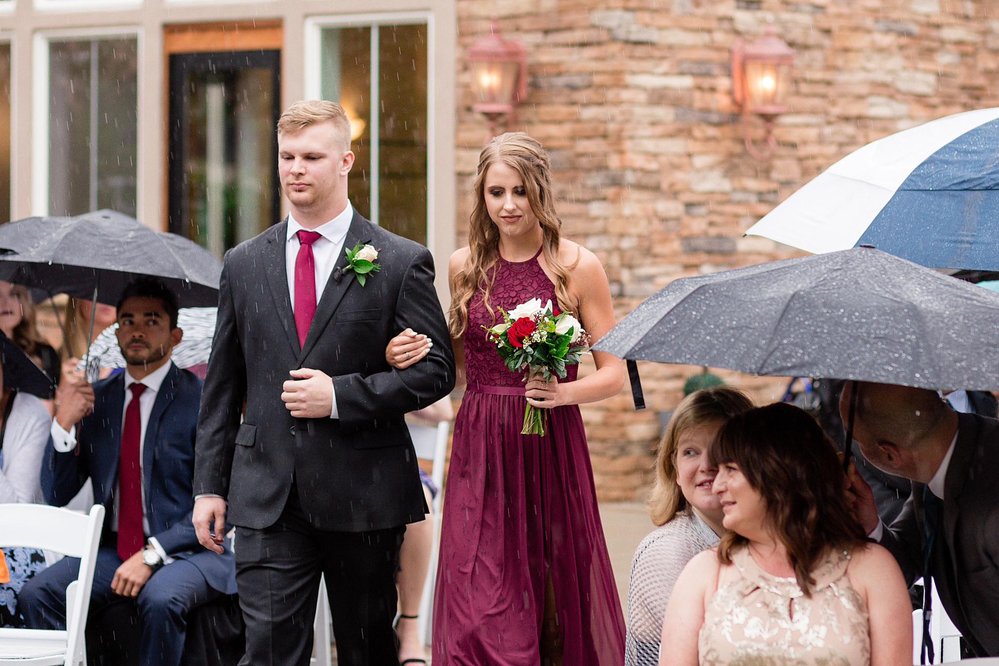 Bridal party walking down the aisle at a rainy summer wedding. Tania & Chris' Denver Wedding at the Wedgewood Ken Caryl by Colorado Wedding Photography, Jennifer Garza. Colorado Wedding Photographer, Colorado Wedding Photography, Denver Wedding Photographer, Denver Wedding Photography, US Marine Corp Wedding, US Marine Corp, Military Wedding, US Marines, Wedgewood Weddings, Wedgewood Weddings Ken Caryl, Colorado Wedding, Denver Wedding, Wedding Photographer, Colorado Bride, Brides of Colorado