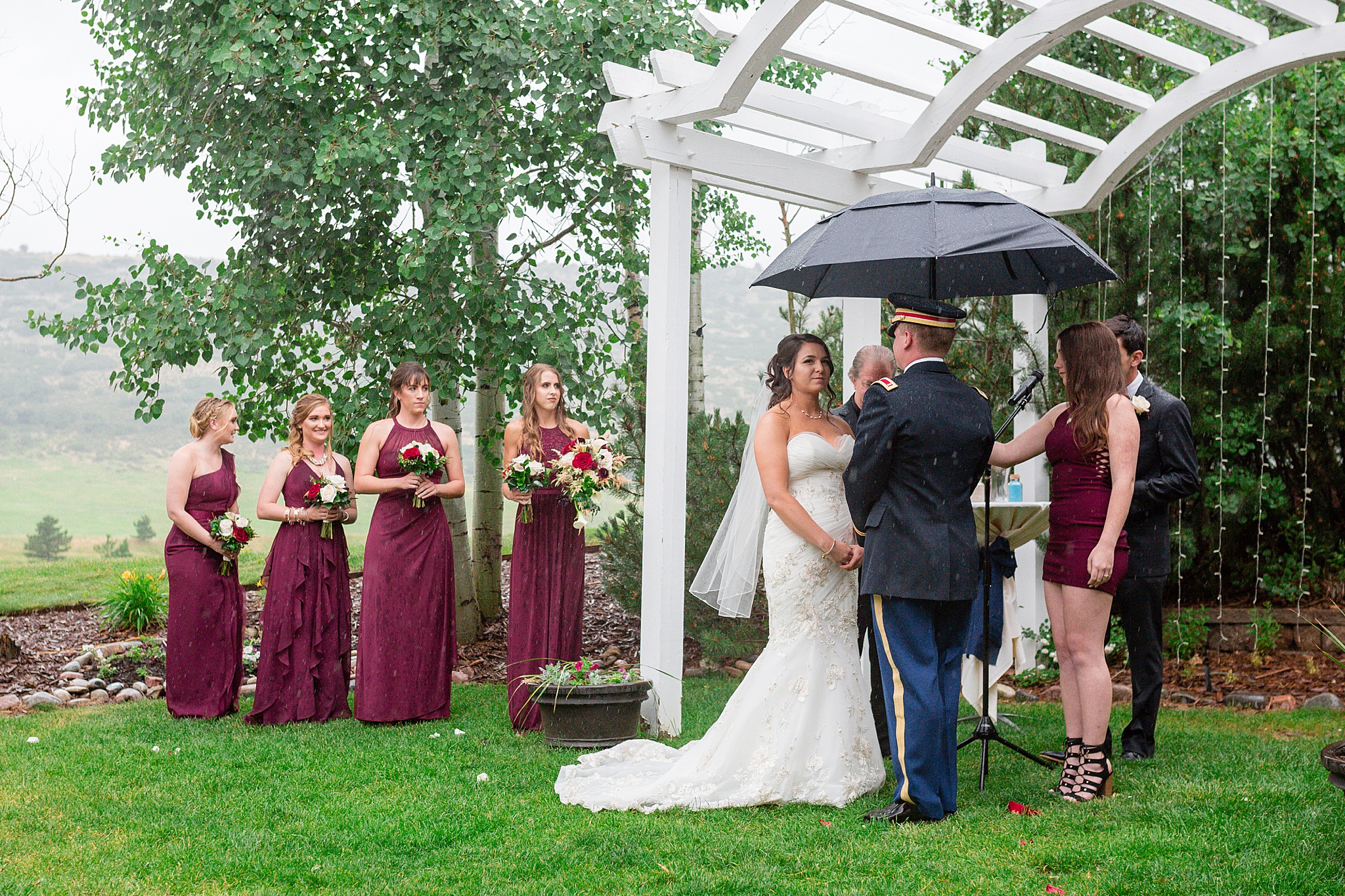 Bride & Groom exchanging vows during a rainy summer wedding. Tania & Chris' Denver Wedding at the Wedgewood Ken Caryl by Colorado Wedding Photography, Jennifer Garza. Colorado Wedding Photographer, Colorado Wedding Photography, Denver Wedding Photographer, Denver Wedding Photography, US Marine Corp Wedding, US Marine Corp, Military Wedding, US Marines, Wedgewood Weddings, Wedgewood Weddings Ken Caryl, Colorado Wedding, Denver Wedding, Wedding Photographer, Colorado Bride, Brides of Colorado