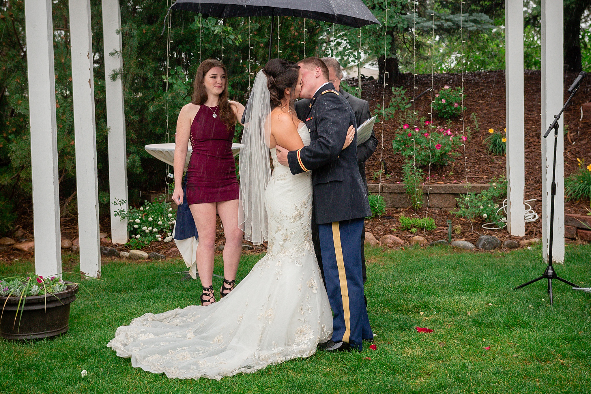 Bride & Groom’s first kiss during a rainy summer wedding. Tania & Chris' Denver Wedding at the Wedgewood Ken Caryl by Colorado Wedding Photography, Jennifer Garza. Colorado Wedding Photographer, Colorado Wedding Photography, Denver Wedding Photographer, Denver Wedding Photography, US Marine Corp Wedding, US Marine Corp, Military Wedding, US Marines, Wedgewood Weddings, Wedgewood Weddings Ken Caryl, Colorado Wedding, Denver Wedding, Wedding Photographer, Colorado Bride, Brides of Colorado
