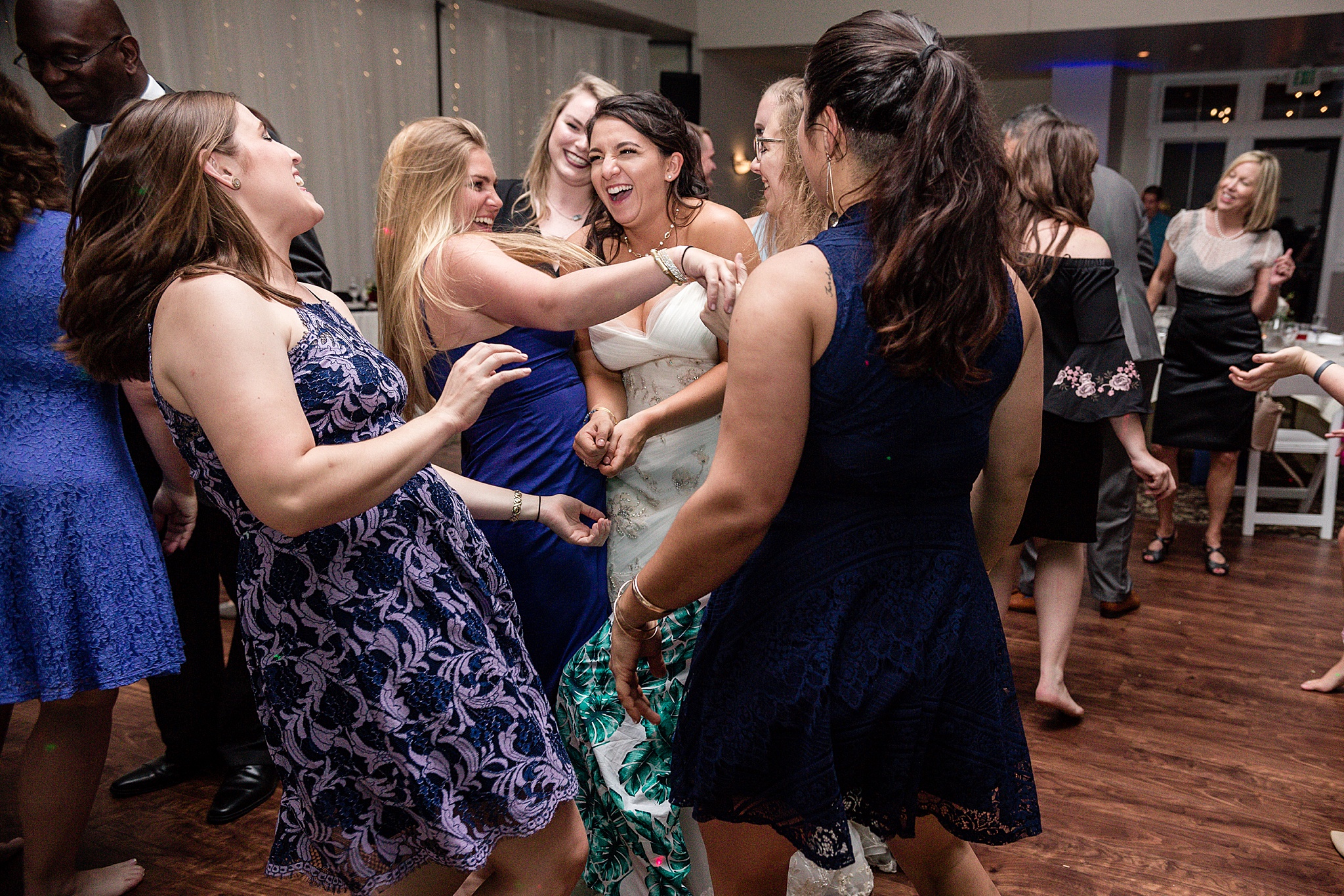 Bride and guests dancing during the wedding reception. Tania & Chris' Denver Wedding at the Wedgewood Ken Caryl by Colorado Wedding Photography, Jennifer Garza. Colorado Wedding Photographer, Colorado Wedding Photography, Denver Wedding Photographer, Denver Wedding Photography, US Marine Corp Wedding, US Marine Corp, Military Wedding, US Marines, Wedgewood Weddings, Wedgewood Weddings Ken Caryl, Colorado Wedding, Denver Wedding, Wedding Photographer, Colorado Bride, Brides of Colorado