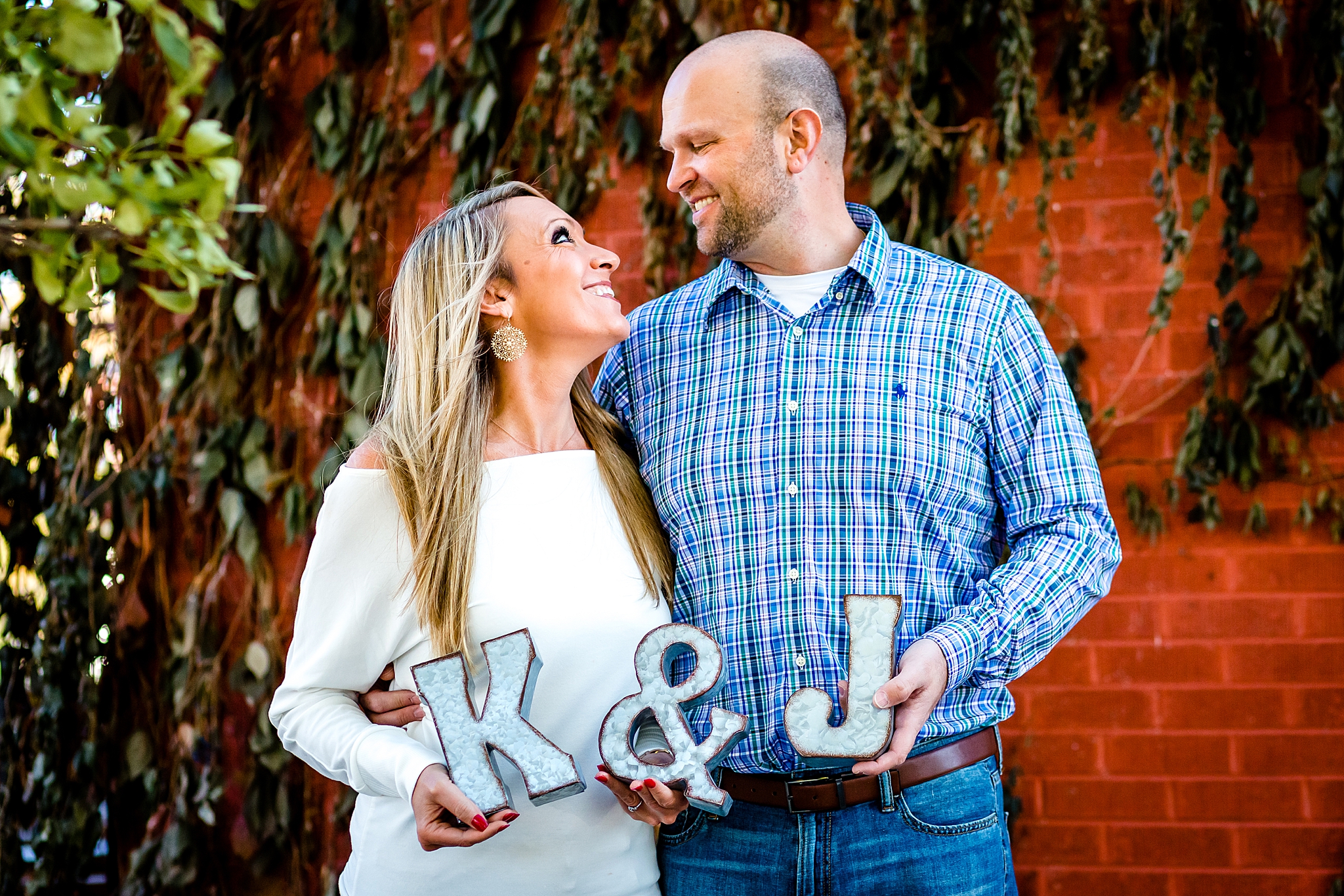 Couple holding up their initials with metal letters during their Colorado engagement session. Kelli & Jason’s Sweet Cow Ice Cream and Davidson Mesa Fall Engagement Session by Colorado Engagement Photographer, Jennifer Garza. Colorado Engagement Photographer, Colorado Engagement Photography, Sweet Cow Engagement Session, Davidson Mesa Engagement Session, Colorado Fall Engagement Photos, Fall Engagement Photography, Mountain Engagement Photographer, Colorado Wedding, Colorado Bride, MagMod