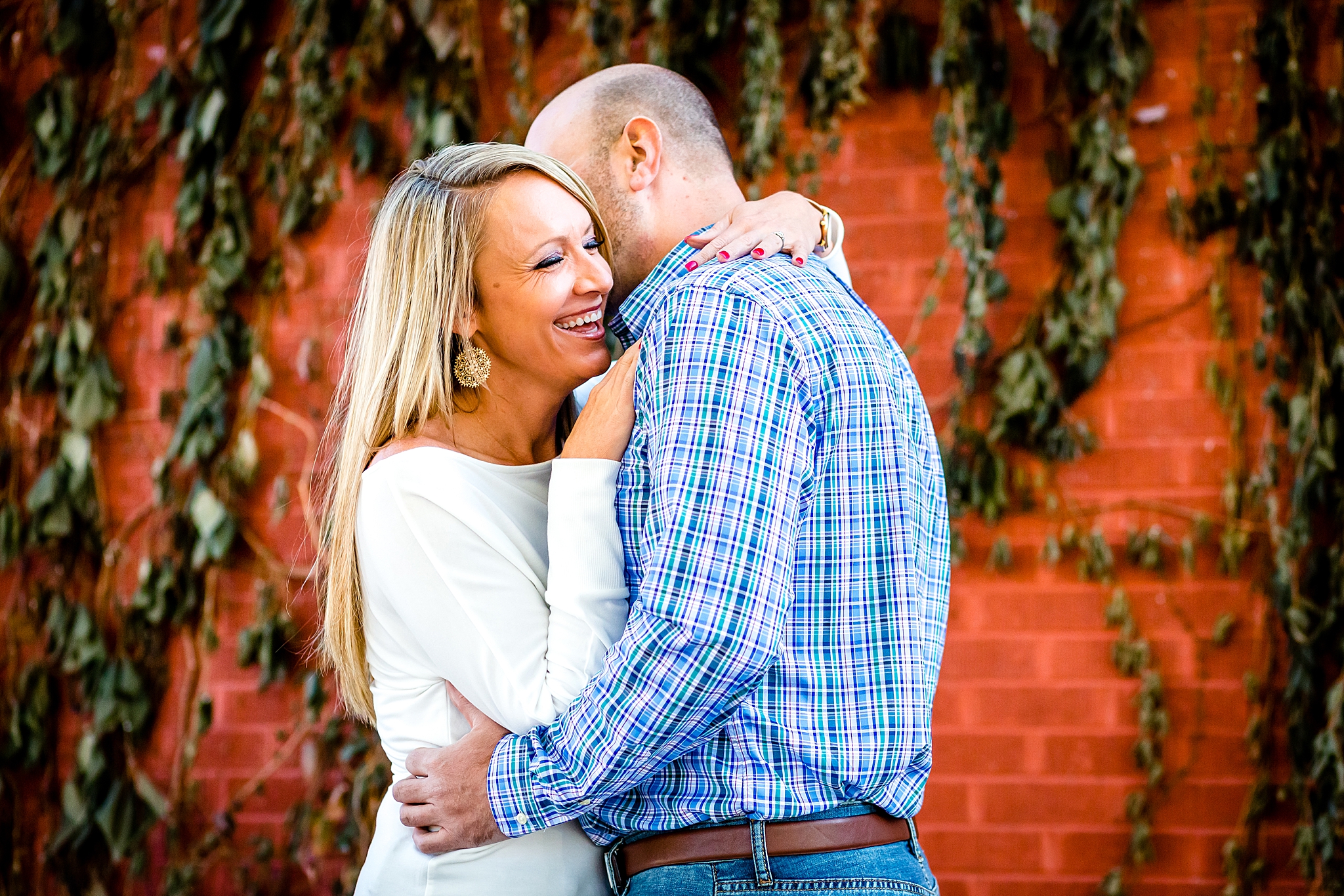 Couple kissing in front of an ivy covered, red brick wall Colorado during their engagement session. Kelli & Jason’s Sweet Cow Ice Cream and Davidson Mesa Fall Engagement Session by Colorado Engagement Photographer, Jennifer Garza. Colorado Engagement Photographer, Colorado Engagement Photography, Sweet Cow Engagement Session, Davidson Mesa Engagement Session, Colorado Fall Engagement Photos, Fall Engagement Photography, Mountain Engagement Photographer, Colorado Wedding, Colorado Bride, MagMod