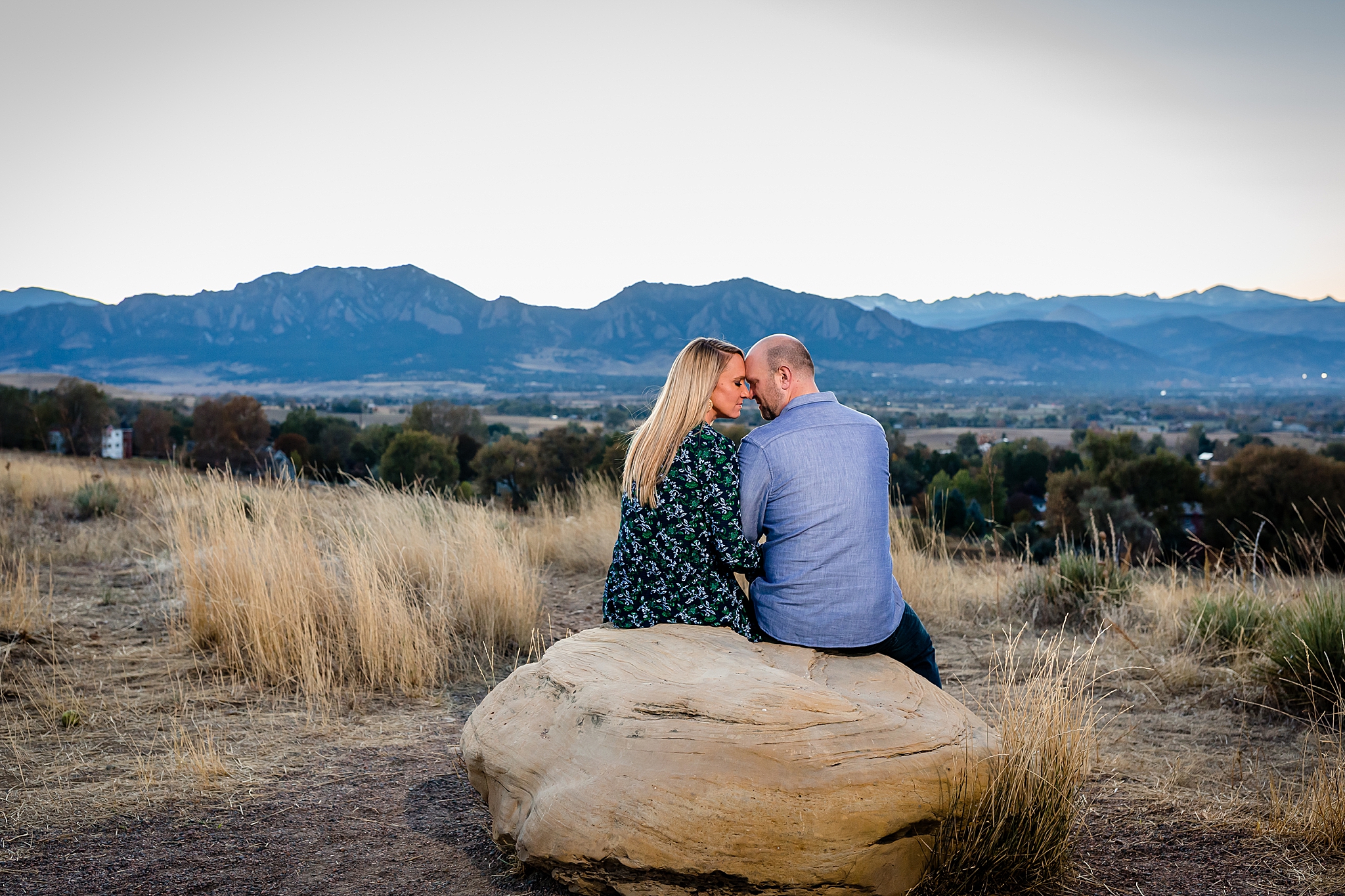 Engaged couple sitting together enjoying the mountain view during their Colorado engagement session. Kelli & Jason’s Sweet Cow Ice Cream and Davidson Mesa Fall Engagement Session by Colorado Engagement Photographer, Jennifer Garza. Colorado Engagement Photographer, Colorado Engagement Photography, Sweet Cow Engagement Session, Davidson Mesa Engagement Session, Colorado Fall Engagement Photos, Fall Engagement Photography, Mountain Engagement Photographer, Colorado Wedding, Colorado Bride, MagMod