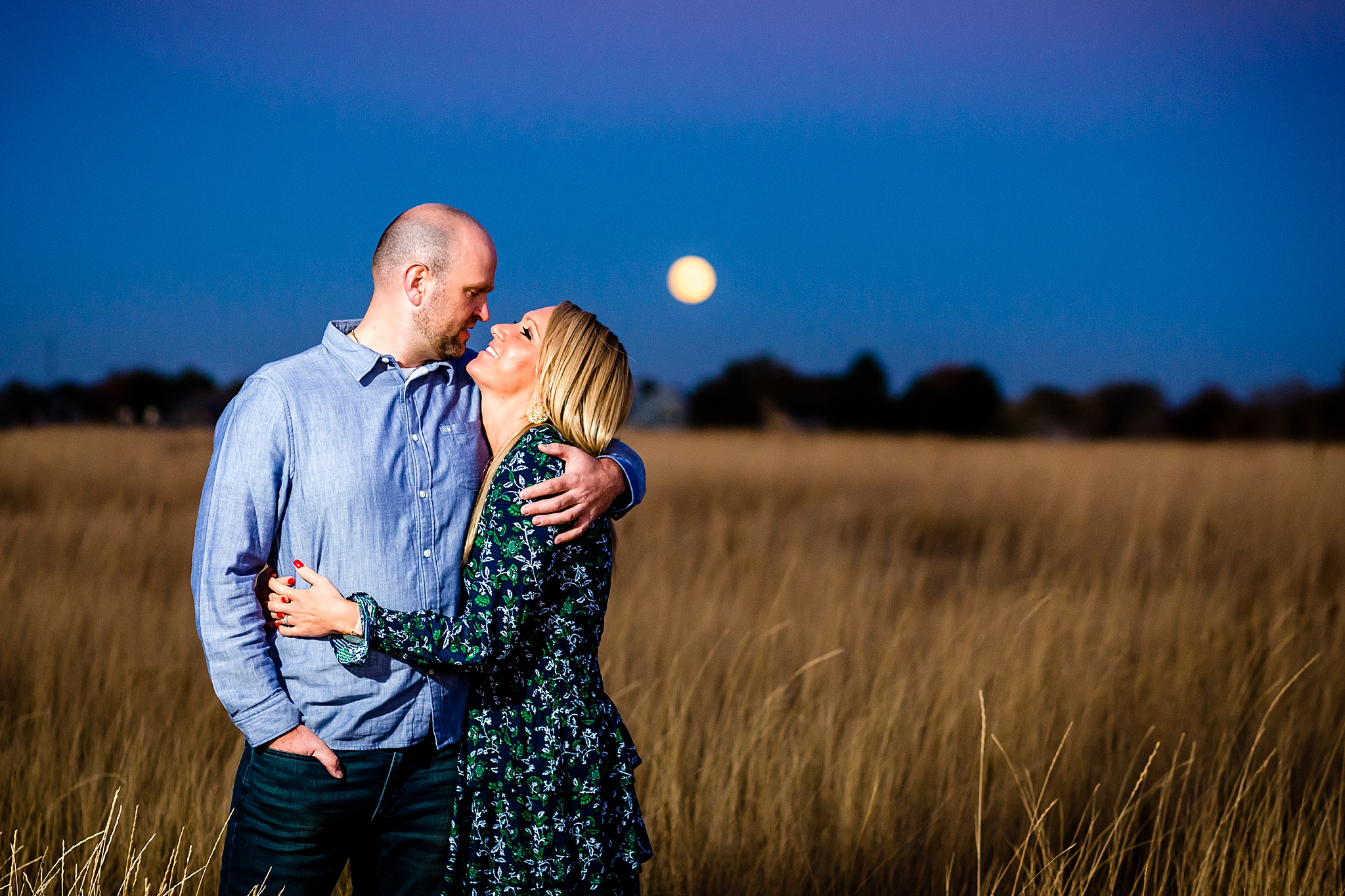 Engaged couple hugging with the moon rising behind them during their Colorado engagement session. Kelli & Jason’s Sweet Cow Ice Cream and Davidson Mesa Fall Engagement Session by Colorado Engagement Photographer, Jennifer Garza. Colorado Engagement Photographer, Colorado Engagement Photography, Sweet Cow Engagement Session, Davidson Mesa Engagement Session, Colorado Fall Engagement Photos, Fall Engagement Photography, Mountain Engagement Photographer, Colorado Wedding, Colorado Bride, MagMod