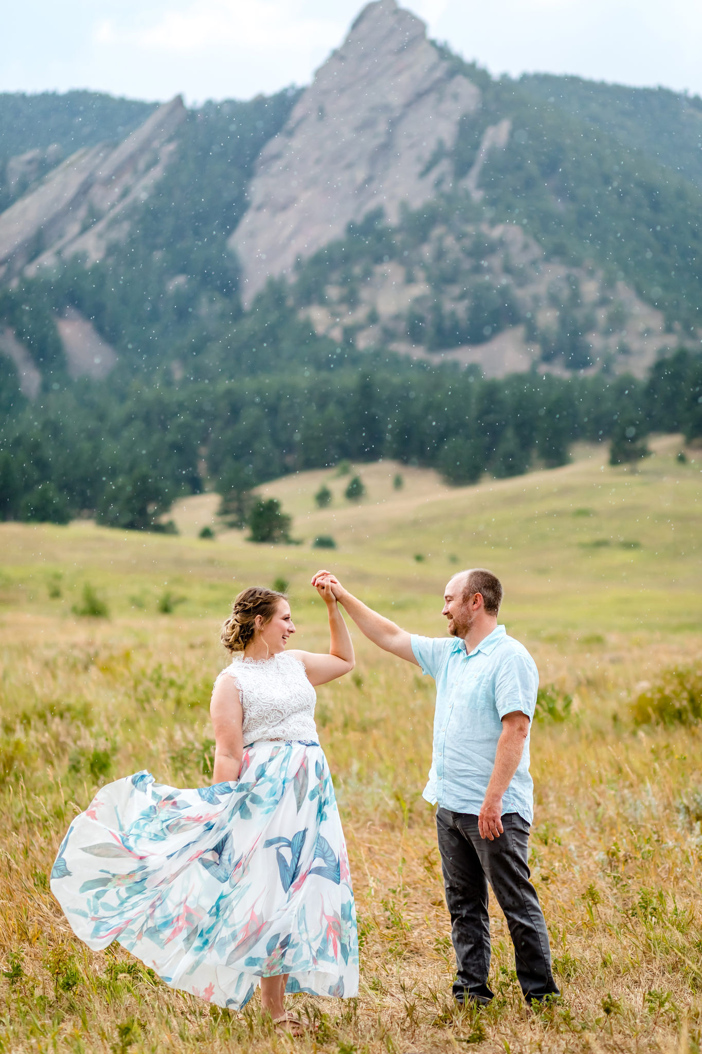 Lauren & Taylor dancing in the rain in a field at Chautauqua Park in front of the Colorado Flatirons. Mountain Fall Engagement Session by Colorado Engagement Photographer, Jennifer Garza. Colorado Fall Engagement, Colorado Fall Engagement Photos, Fall Engagement Photography, Fall Engagement Photos, Colorado Engagement Photographer, Colorado Engagement Photography, Mountain Engagement Photographer, Mountain Engagement, Mountain Engagement Photos, Rocky Mountain Bride, Wedding Inspo, Wedding Season, Colorado Wedding, Colorado Bride, Bride to Be, Couples Goals