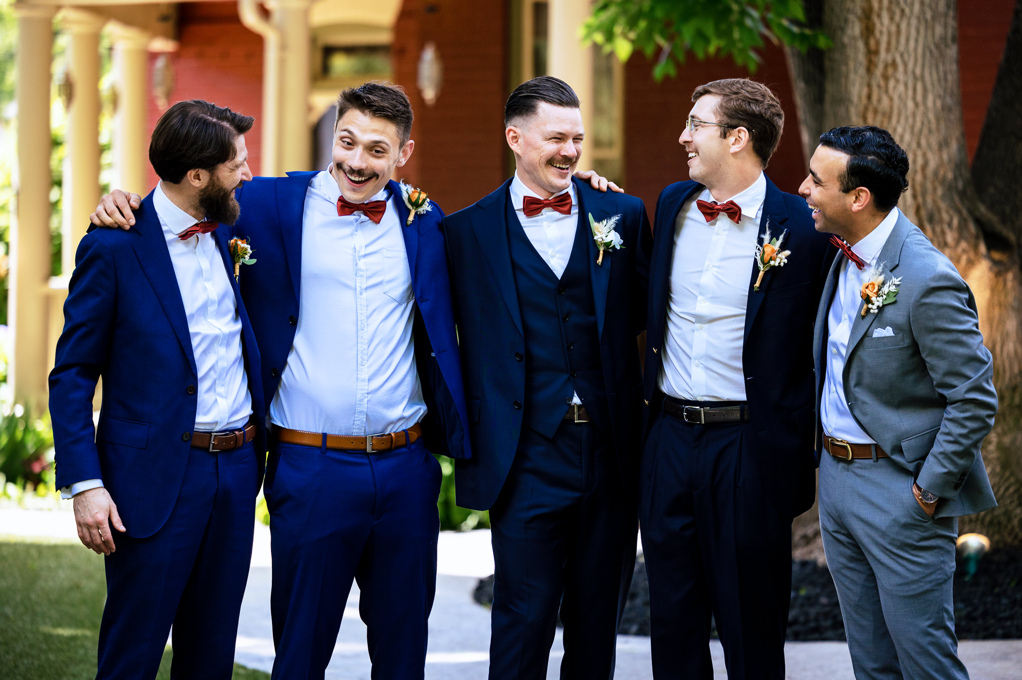 Groom and Groomsmen photo on the lawn for Haley & Gytenis' Summer Wedding at The McCreery House by Colorado Wedding Photographer, Jennifer Garza.