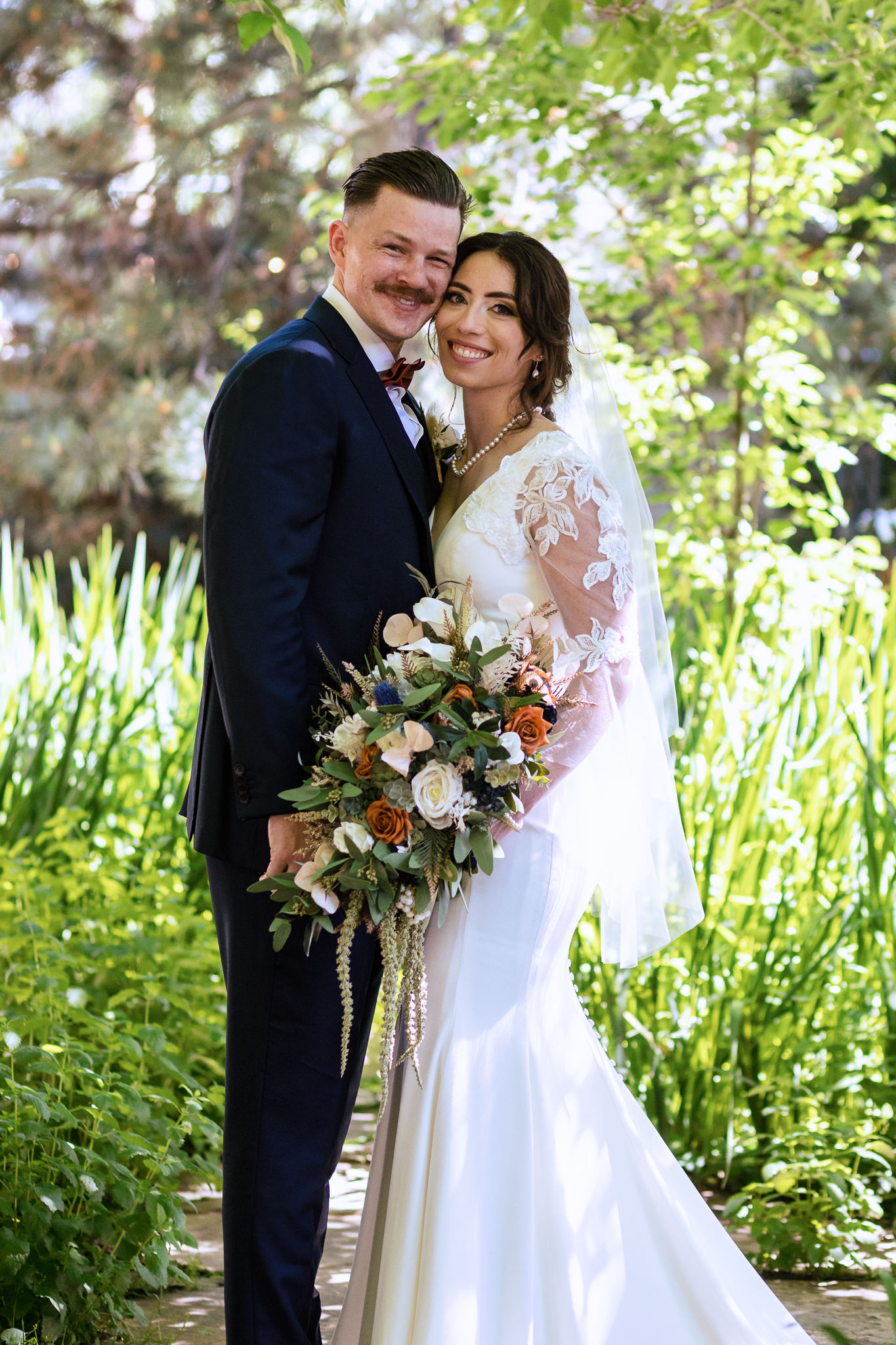 Photo of the bride & groom in the garden for Haley & Gytenis' Summer Wedding at The McCreery House by Colorado Wedding Photographer, Jennifer Garza.