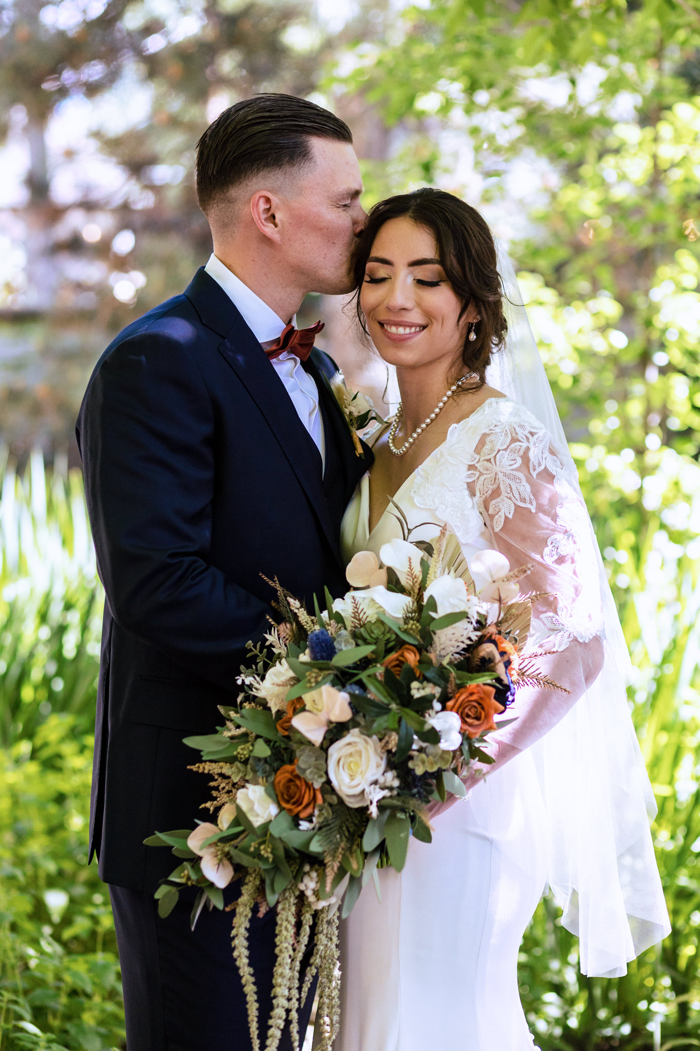 Photo of the bride & groom in the garden for Haley & Gytenis' Summer Wedding at The McCreery House by Colorado Wedding Photographer, Jennifer Garza.