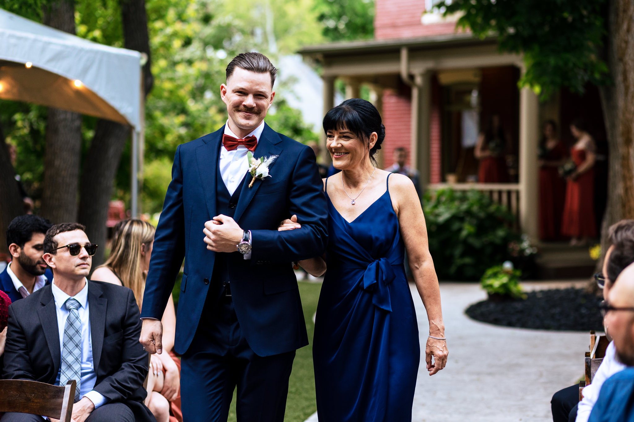 Groom walking his mother down the aisle for Haley & Gytenis' Summer Wedding at The McCreery House by Colorado Wedding Photographer, Jennifer Garza.