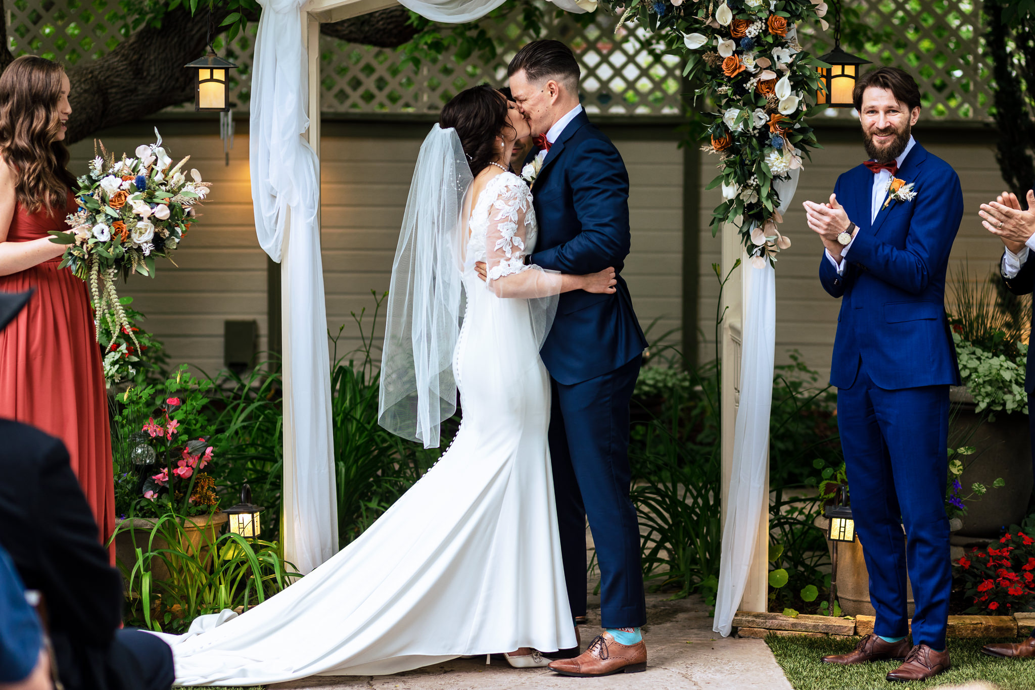Bride & Groom kissing for the first time at the alter for Haley & Gytenis' Summer Wedding at The McCreery House by Colorado Wedding Photographer, Jennifer Garza.